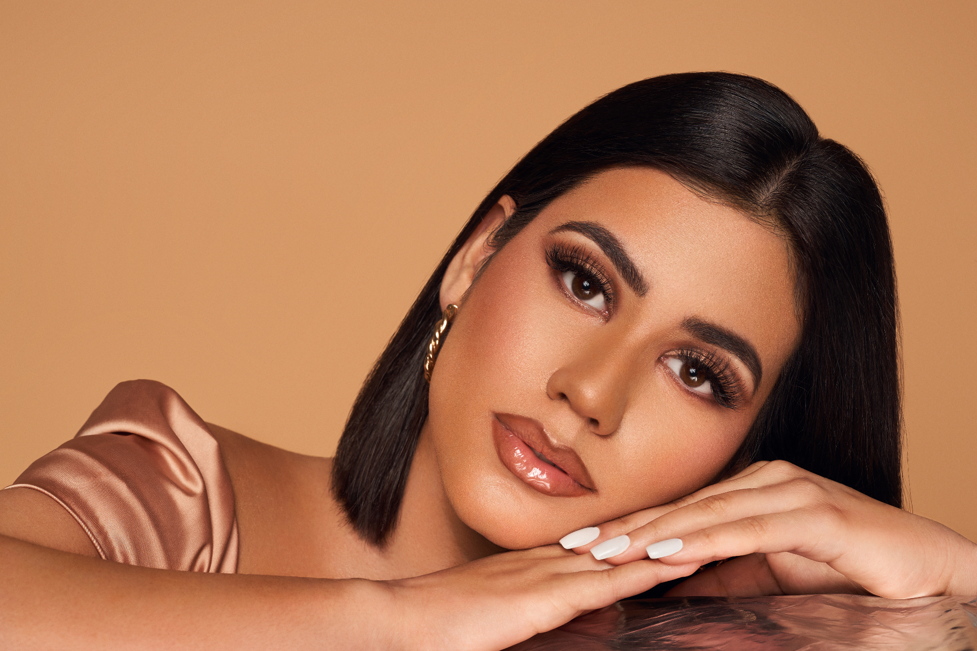 Glossy nude lip and soft glam editorial portrait